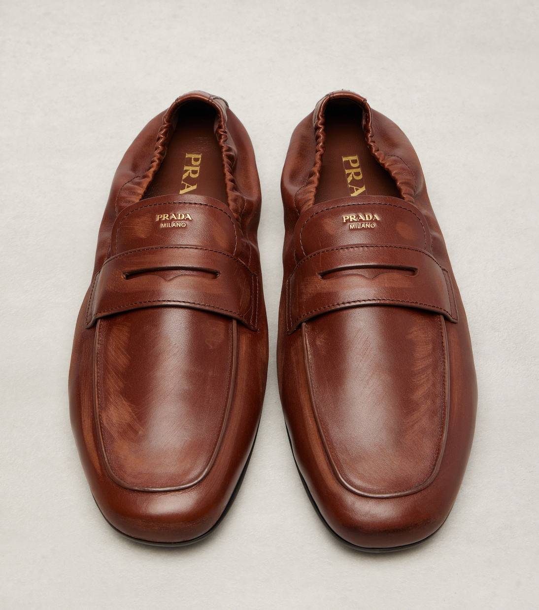 Leather penny loafers in brown - Prada | Mytheresa