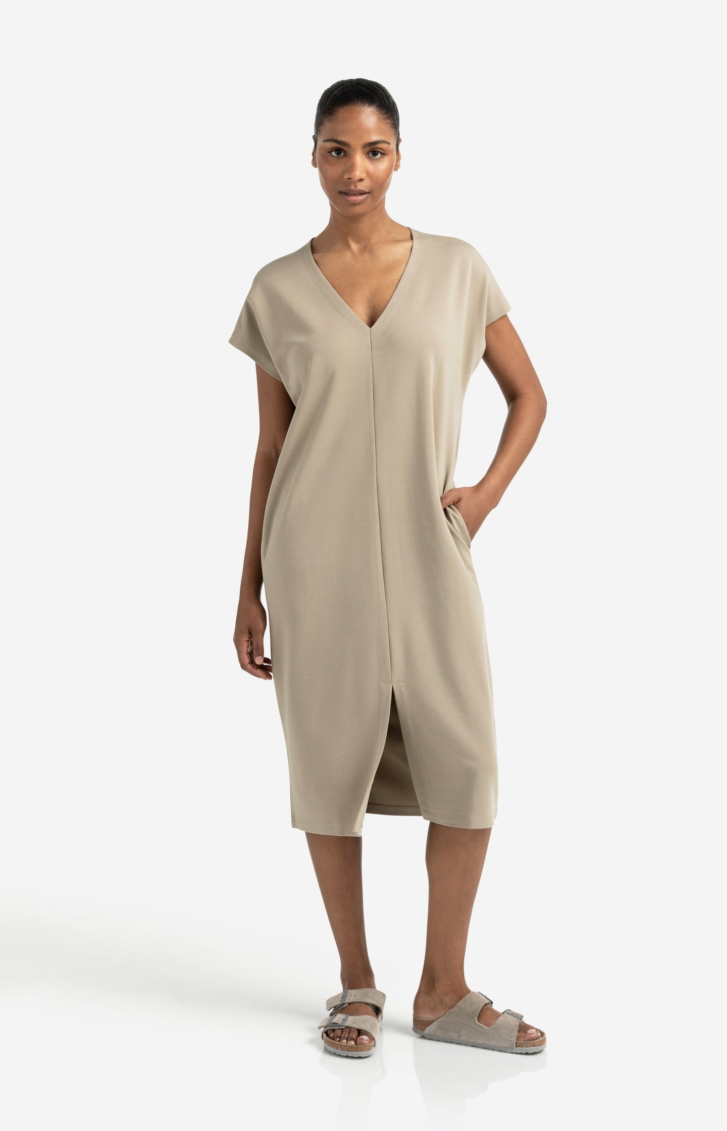 Sleeveless dress with double V-neck and front slit