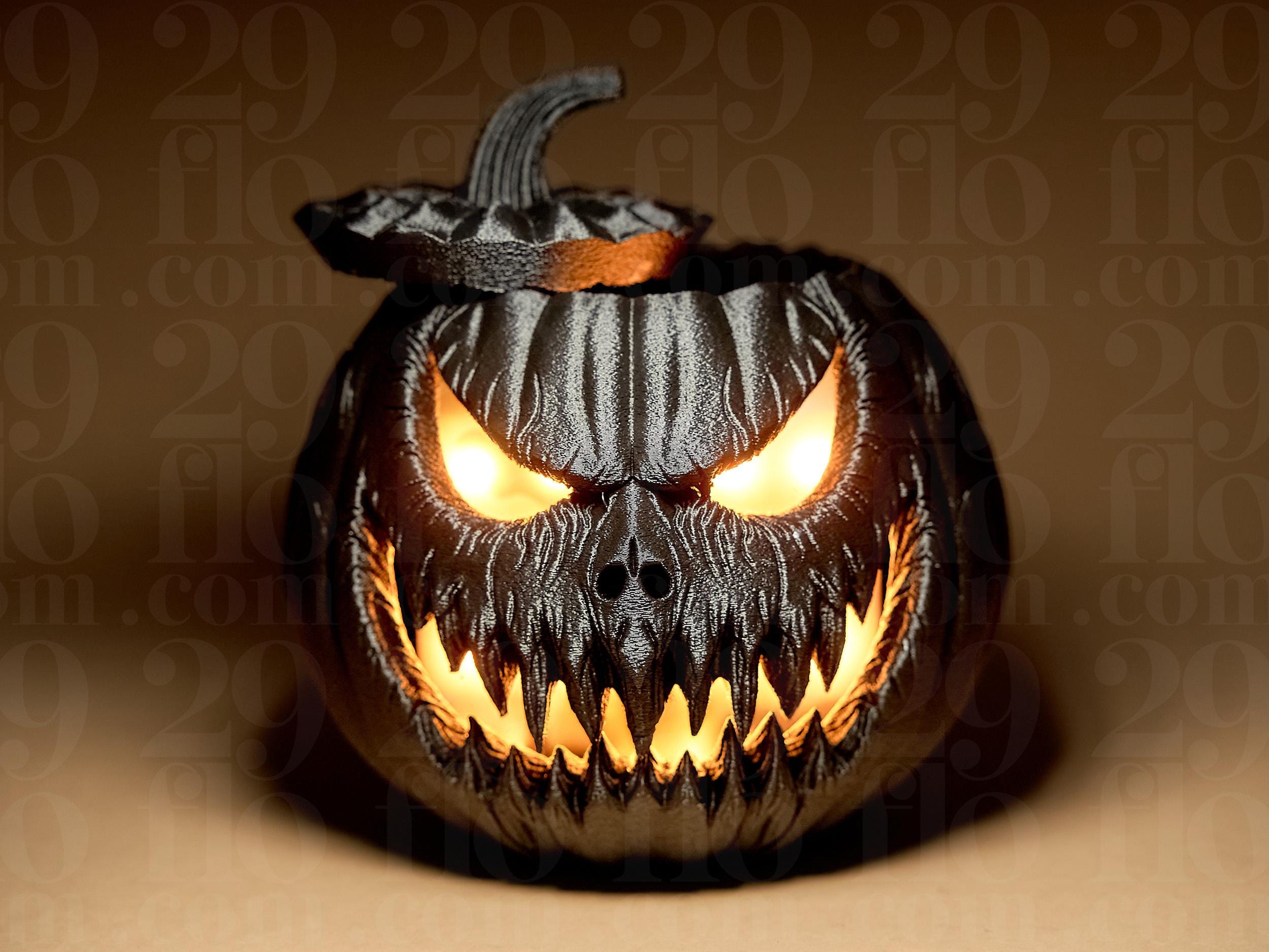 ハロウィンかぼちゃのデコレーション – 恐ろしい顔をした黒くて怖い