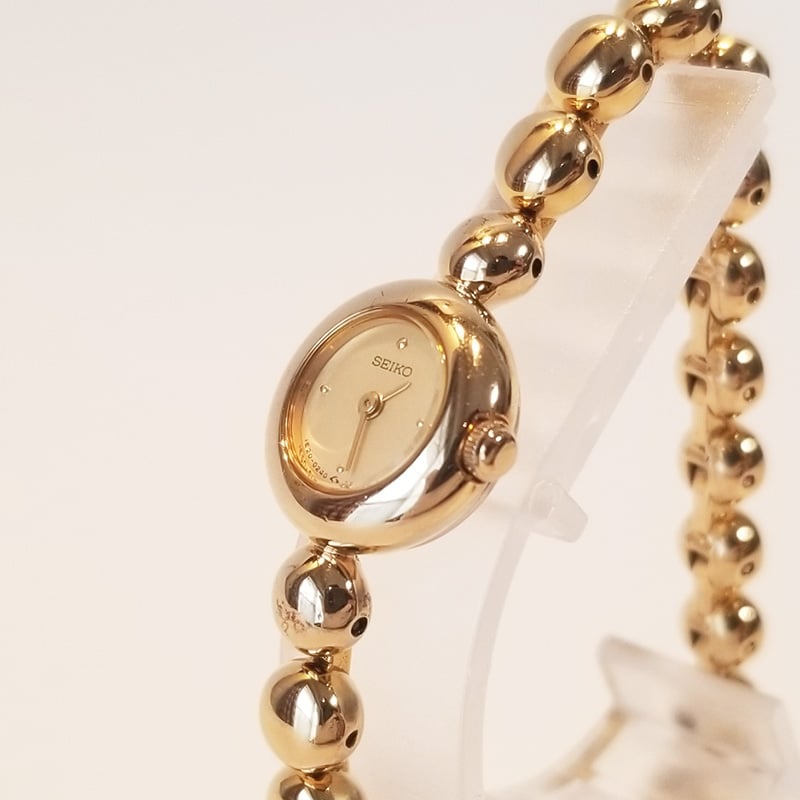 SEIKO セイコー レディース腕時計 ゴールド クォーツ 1E20-0070 不動