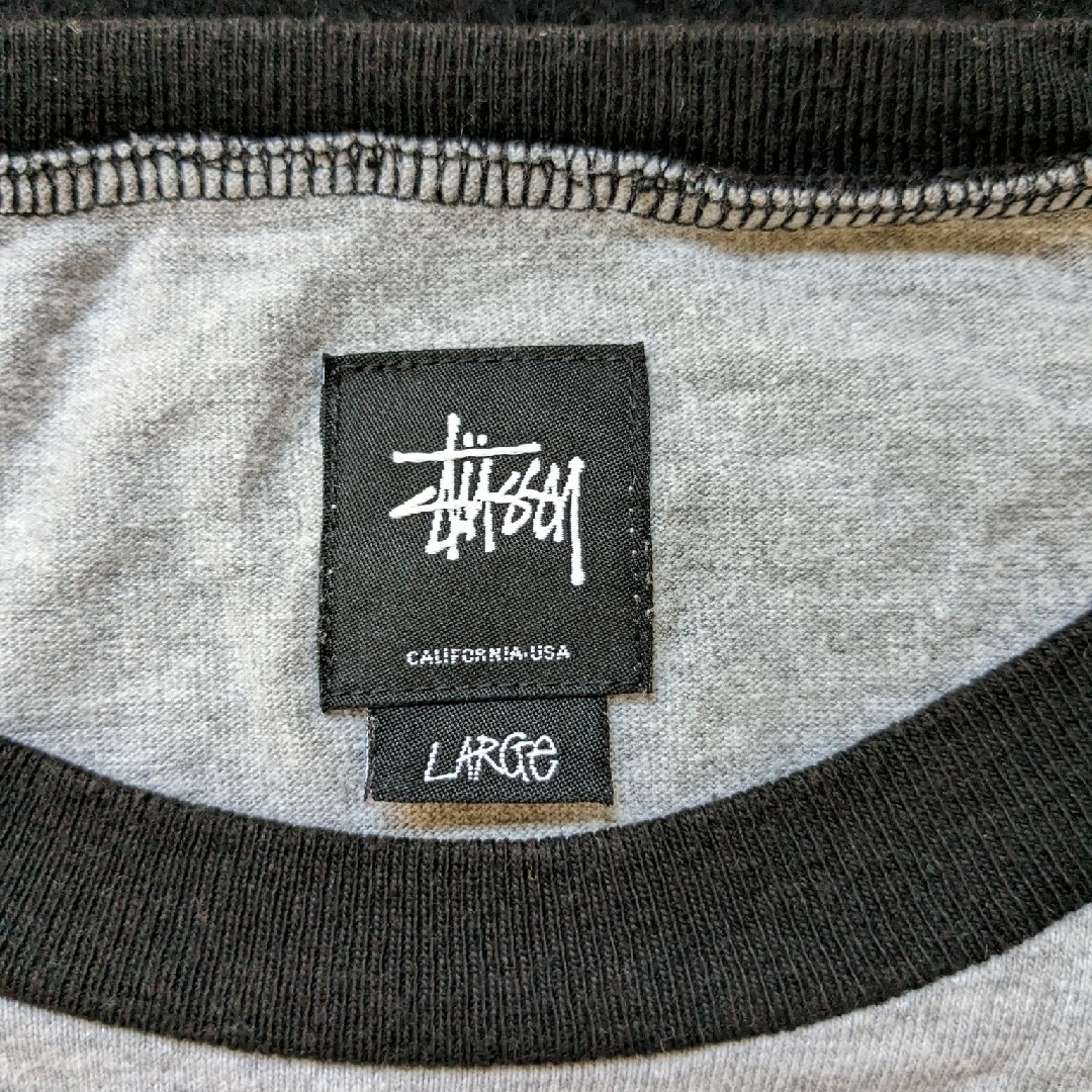 STUSSY - STUSSY 花柄 ワールドツアー 7分袖Tシャツ L 灰色 黒色
