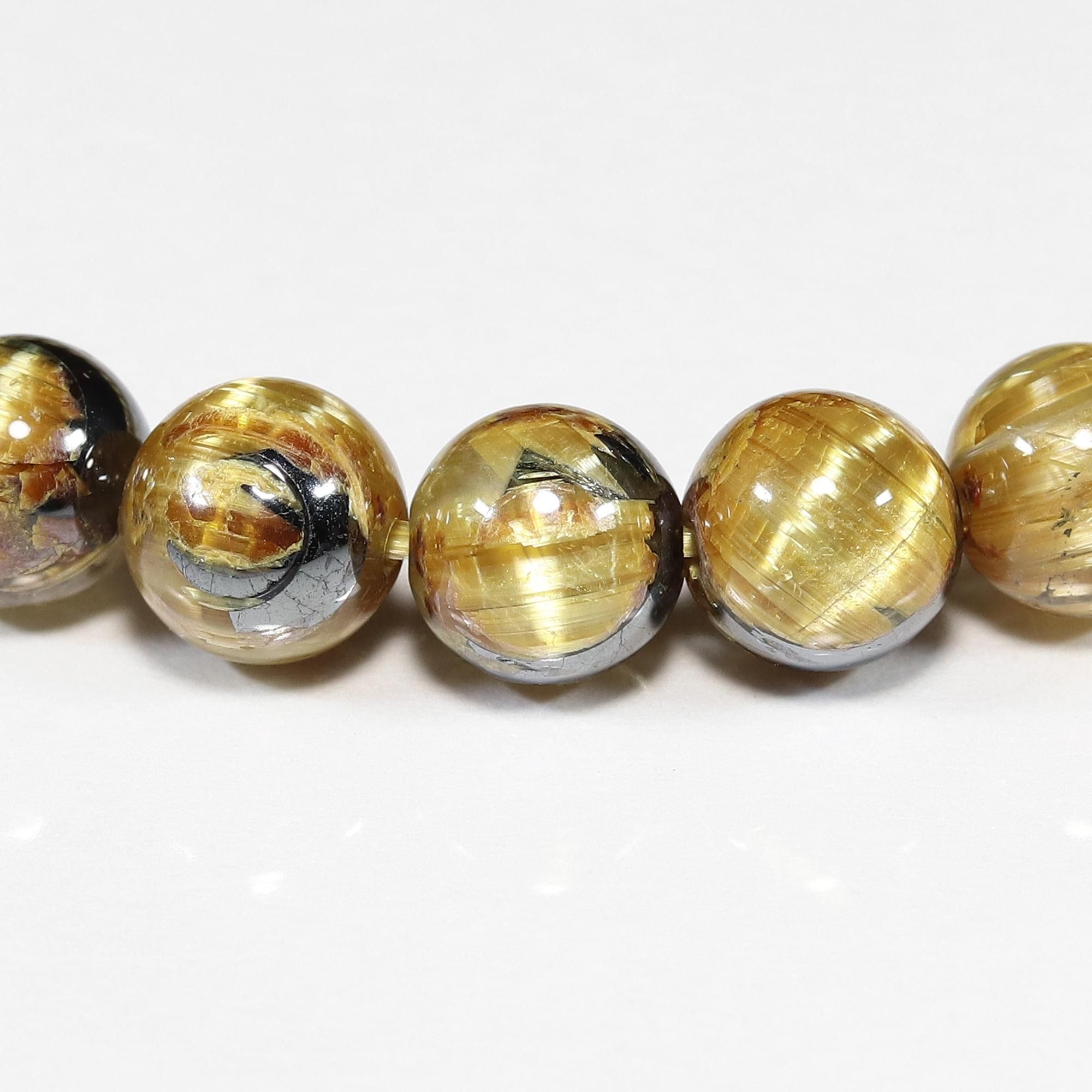 高品質+】太陽放射タイチンルチルクォーツ(キャッツアイ効果入り) 6.5